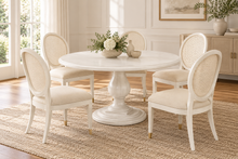 Load image into Gallery viewer, The 54 inch Lafayette Dining Table hits the sweet spot for round dining—generous enough to seat six comfortably, yet intimate enough to keep conversation effortless. Designed by Phillips Scott and crafted from hardwood solids and veneers, the table features a layered molded edge, sculptural turned pedestal, and substantial tiered base. Good Bones Furniture