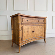 Load image into Gallery viewer, A wooden storage cabinet with a concave silhouette and faux bamboo accents, featuring a drawer and two cabinet doors.
