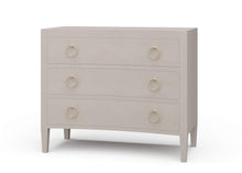 Load image into Gallery viewer, The Mornington Linen Wrapped 3 Drawer Chest pairs a clean, tailored silhouette with the subtle texture of painted linen. Built with a solid mahogany frame beneath the wrapped finish, it offers the structure and weight of fine case goods with a softer, more decorated surface. Three spacious drawers, tapered legs, and brass ring hardware. Good Bones Furniture
