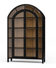 Load image into Gallery viewer, The Vannes 2 Door Display Cabinet from Bramble combines architectural scale with warm natural materials, creating a statement piece designed for both storage and display. Crafted from solid mahogany, the cabinet features a dramatic arched silhouette with glass-paneled doors framed in a rich contrasting finish that highlights the craftsmanship and curvature of the design. Good Bones Furniture