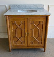 Load image into Gallery viewer, Bring a touch of classic charm & modern sophistication to your bathroom with the Bramble Grosvenor Single Vanity. Featuring gorgeous faux bamboo fretwork on its two cabinet doors, this piece is a true showstopper that blends timeless design with functional luxury. Crafted from solid mahogany and available in a variety of finishes, this vanity is topped with a luxurious marble countertop and integrated sink. Good Bones Furniture