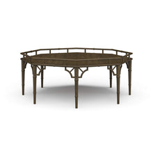 Load image into Gallery viewer, The Bramble Grosvenor Thrupence Coffee Table brings sculptural form and classic British-inspired detailing into a bold statement piece designed for sophisticated living spaces. Crafted from solid mahogany, the octagonal silhouette is framed by an architectural bamboo-inspired gallery rail that gives the table its distinctive presence and refined character. Good Bones Furniture