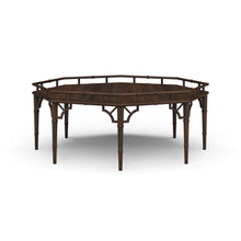 Load image into Gallery viewer, The Bramble Grosvenor Thrupence Coffee Table brings sculptural form and classic British-inspired detailing into a bold statement piece designed for sophisticated living spaces. Crafted from solid mahogany, the octagonal silhouette is framed by an architectural bamboo-inspired gallery rail that gives the table its distinctive presence and refined character. Good Bones Furniture