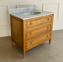Load image into Gallery viewer, Upgrade your space with this stunning Bramble Cholet single bathroom vanity, where classic design meets modern functionality. Crafted from solid mahogany in a variety of finishes, this piece brings warmth and timeless beauty to any bathroom.
Topped with luxurious marble, with a white American Standard undermount sink. Good Bones Furniture