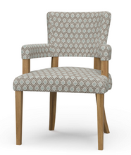 Load image into Gallery viewer, The Bramble Genevieve Dining Chair combines timeless elegance with unsurpassed comfort, making it a luxurious addition to any dining space. Handcrafted from solid mahogany, it boasts a sturdy frame and refined proportions. Padded arms and curved, padded back. Performance fabric. Good Bones Furniture