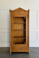 Load image into Gallery viewer, The Dunehaven Bamboo Bookcase turns treasured books and collected objects into a beautifully composed display. Its tall, narrow silhouette provides generous vertical storage without requiring a large footprint, making it especially useful in living rooms, libraries, dining rooms, or home offices. Crafted from mahogany solids with mango wood veneers, the cabinet’s Beachwood finish highlights the natural grain and warmth of the wood. Good Bones Furniture
