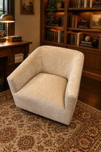 Load image into Gallery viewer, The Coco Swivel Chair by Fairfield Chair pairs a sculptural silhouette with soft color and inviting texture. Upholstered in Dustyrose chenille, its 100% polyester fabric has a plush, dimensional surface and a muted rose tone that adds warmth without overpowering the room. The curved back flows seamlessly into gently sloped arms, creating a comfortable wraparound shape that looks beautiful from every angle. Showroom sample at Good Bones Furniture