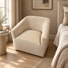 Load image into Gallery viewer, The Coco Swivel Chair by Fairfield Chair pairs a sculptural silhouette with soft color and inviting texture. Upholstered in Dustyrose chenille, its 100% polyester fabric has a plush, dimensional surface and a muted rose tone that adds warmth without overpowering the room. The curved back flows seamlessly into gently sloped arms, creating a comfortable wraparound shape that looks beautiful from every angle. Showroom sample at Good Bones Furniture