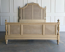 Load image into Gallery viewer, The Frontgate Beauvier French Cane Bed brings timeless Louis XVI style to the bedroom with elegant straight lines, classical ornament, and warm natural texture. Crafted from solid mahogany, it features handwoven double cane panels, twisted ribbon carving, floral swag and laurel wreath detailing, and beaded accents along the rails and finials. Good Bones Furniture