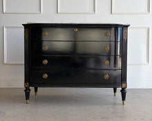 Load image into Gallery viewer, This gently used Regency bow front chest by Frontgate brings classic glamour and tailored storage to the bedroom, entry, or living space. The glossy ebony finish is paired with a Carrara marble top, handpainted gold beading, and gold-accented corner carvings for a refined, high-contrast look. Good Bones Furniture