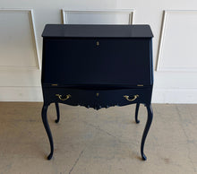 Load image into Gallery viewer, This vintage secretary desk has been professionally lacquered in Sherwin Williams Naval, giving the classic silhouette a rich, dramatic presence while preserving its traditional detailing and graceful cabriole legs. The drop-front desk opens to reveal a warm mahogany interior with divided compartments. Good Bones Furniture