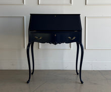 Load image into Gallery viewer, This vintage secretary desk has been professionally lacquered in Sherwin Williams Naval, giving the classic silhouette a rich, dramatic presence while preserving its traditional detailing and graceful cabriole legs. The drop-front desk opens to reveal a warm mahogany interior with divided compartments. Good Bones Furniture