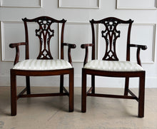 Load image into Gallery viewer, Classic craftsmanship never goes out of style. This exceptional set of eight Henredon Chippendale dining chairs showcases the artistry and quality that made Henredon one of America's premier furniture makers. Crafted from richly finished mahogany, each chair features an intricately carved pierced splat back inspired by 18th-century Chippendale designs, accented with elegant detailing and crisp architectural lines. Good Bones Furniture
