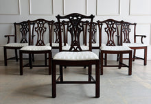 Load image into Gallery viewer, Classic craftsmanship never goes out of style. This exceptional set of eight Henredon Chippendale dining chairs showcases the artistry and quality that made Henredon one of America's premier furniture makers. Crafted from richly finished mahogany, each chair features an intricately carved pierced splat back inspired by 18th-century Chippendale designs, accented with elegant detailing and crisp architectural lines. Good Bones Furniture
