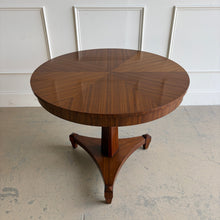 Load image into Gallery viewer, This Hickory White Ethan Center Table is a showroom sample in excellent condition, designed to bring refined presence to an entry, living space, or intimate dining area. Crafted from mahogany solids with quarter-sliced African mahogany veneer, the top showcases a dramatic sunburst pattern with book-matched wedges for a tailored, furniture-maker finish. The Maison finish is a rich dark walnut enhanced with hand-burnished edges, cow tailing, and a light antique spatter—details that add depth and a softly aged