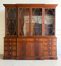 Load image into Gallery viewer, The Jonathan Charles Mahogany Breakfront Secretary Bookcase is a statement piece that combines the functionality of a library cabinet, secretary desk, display cabinet, and storage credenza in a single heirloom-quality design. Crafted with richly figured flame mahogany veneers, the cabinet showcases the level of craftsmanship that has made Jonathan Charles a respected name among collectors, designers, and luxury furniture retailers. Good Bones Furniture