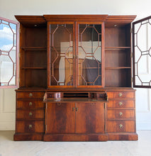 Load image into Gallery viewer, The Jonathan Charles Mahogany Breakfront Secretary Bookcase is a statement piece that combines the functionality of a library cabinet, secretary desk, display cabinet, and storage credenza in a single heirloom-quality design. Crafted with richly figured flame mahogany veneers, the cabinet showcases the level of craftsmanship that has made Jonathan Charles a respected name among collectors, designers, and luxury furniture retailers. Good Bones Furniture