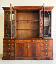 Load image into Gallery viewer, The Jonathan Charles Mahogany Breakfront Secretary Bookcase is a statement piece that combines the functionality of a library cabinet, secretary desk, display cabinet, and storage credenza in a single heirloom-quality design. Crafted with richly figured flame mahogany veneers, the cabinet showcases the level of craftsmanship that has made Jonathan Charles a respected name among collectors, designers, and luxury furniture retailers. Good Bones Furniture