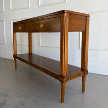 Load image into Gallery viewer, The Lipton 2 Drawer Console Table is a study in balance—combining classical detailing with a clean, tailored silhouette. Fluted legs, subtle carved accents, and a lower display shelf give the piece a refined, architectural presence, while the overall proportions keep it light and versatile. The drawer fronts are wrapped in richly figured cerejeira veneer. Good Bones Furniture