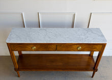 Load image into Gallery viewer, The Lipton 2 Drawer Console Table is a study in balance—combining classical detailing with a clean, tailored silhouette. Fluted legs, subtle carved accents, and a lower display shelf give the piece a refined, architectural presence, while the overall proportions keep it light and versatile. The drawer fronts are wrapped in richly figured cerejeira veneer. Good Bones Furniture