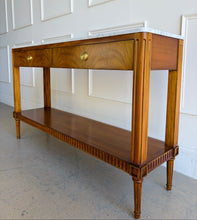Load image into Gallery viewer, The Lipton 2 Drawer Console Table is a study in balance—combining classical detailing with a clean, tailored silhouette. Fluted legs, subtle carved accents, and a lower display shelf give the piece a refined, architectural presence, while the overall proportions keep it light and versatile. The drawer fronts are wrapped in richly figured cerejeira veneer. Good Bones Furniture