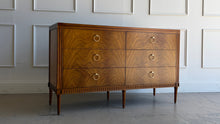 Load image into Gallery viewer, The Lipton Six Drawer Dresser blends neoclassical restraint with the warmth and refinement of early-20th-century European cabinetry. Its silhouette is grounded and architectural, yet softened by subtle curves, tapered legs, and a finely scaled apron—details that keep the piece feeling elegant rather than formal. Good Bones Furniture