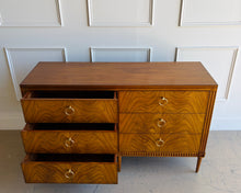 Load image into Gallery viewer, The Lipton Six Drawer Dresser blends neoclassical restraint with the warmth and refinement of early-20th-century European cabinetry. Its silhouette is grounded and architectural, yet softened by subtle curves, tapered legs, and a finely scaled apron—details that keep the piece feeling elegant rather than formal. Good Bones Furniture