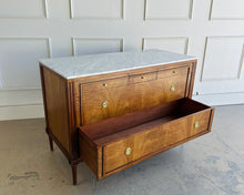 Load image into Gallery viewer, The Lipton Accent Chest is an exquisite blend of classic design and modern luxury. Crafted from mahogany solids with cerejeira and mahogany veneers, this piece showcases a stunning, highly figured grain pattern framed by elegant fluted corner details. The smooth white marble top or luxurious mahogany top adds a timeless sophistication and practical durability, making this chest as functional as it is beautiful. Good Bones Furniture