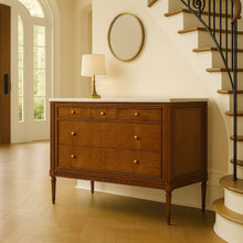 Load image into Gallery viewer, The Lipton Accent Chest is an exquisite blend of classic design and modern luxury. Crafted from mahogany solids with cerejeira and mahogany veneers, this piece showcases a stunning, highly figured grain pattern framed by elegant fluted corner details. The smooth white marble top or luxurious mahogany top adds a timeless sophistication and practical durability, making this chest as functional as it is beautiful. Good Bones Furniture