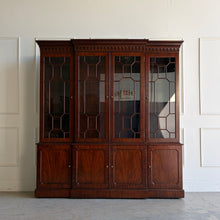 Load image into Gallery viewer, This Georgian-style breakfront china cabinet by Maitland Smith showcases the impeccable construction and richly figured mahogany the maker is known for. The upper cabinet features an illuminated interior behind glass-paneled doors, with adjustable glass shelves that beautifully display china, books, or collected objects. The top is made in three separate sections for easier transport and installation. Good Bones Furniture