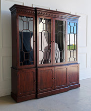 Load image into Gallery viewer, This Georgian-style breakfront china cabinet by Maitland Smith showcases the impeccable construction and richly figured mahogany the maker is known for. The upper cabinet features an illuminated interior behind glass-paneled doors, with adjustable glass shelves that beautifully display china, books, or collected objects. The top is made in three separate sections for easier transport and installation. Good Bones Furniture