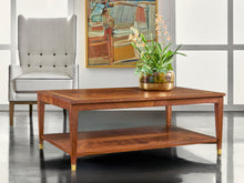 Load image into Gallery viewer, The Modern History Bezier Cocktail Table showcases the natural beauty of richly figured wood in a clean, architectural form. Crafted with French walnut and olive ash burl veneers, the top features striking grain movement framed by a contrasting border that highlights the intricate patterns of the wood. Good Bones Furniture