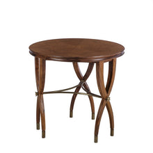 Load image into Gallery viewer, The Modern History Marchand End Table combines refined craftsmanship with sculptural design. A beautifully figured walnut veneer top showcases rich grain variation arranged in a radial pattern, giving the surface visual depth and warmth. The table’s elegant curved legs intersect with a brass stretcher, creating an architectural base that feels both light and structurally balanced. Good Bones Furniture