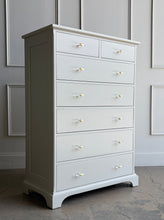 Load image into Gallery viewer, This Newport Cabinet Company chest has been professionally lacquered in Benjamin Moore Natural Cream for a bright, elegant finish that highlights its timeless design. Seven deep drawers provide generous vertical storage. Good Bones Furniture