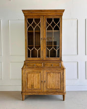 Load image into Gallery viewer, Elevate your dining or living space with the timeless elegance of the Rosalind China Cabinet. Handcrafted from solid mango wood and mango wood veneers, this cabinet combines durability with natural beauty, showcasing the wood's rich, warm tones and unique grain patterns. Its sleek design is complemented by solid brass hardware, adding a touch of refined sophistication. Good Bones Furniture