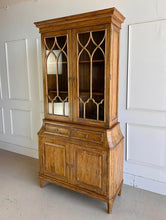 Load image into Gallery viewer, Elevate your dining or living space with the timeless elegance of the Rosalind China Cabinet. Handcrafted from solid mango wood and mango wood veneers, this cabinet combines durability with natural beauty, showcasing the wood's rich, warm tones and unique grain patterns. Its sleek design is complemented by solid brass hardware, adding a touch of refined sophistication. Good Bones Furniture