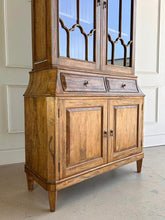 Load image into Gallery viewer, Elevate your dining or living space with the timeless elegance of the Rosalind China Cabinet. Handcrafted from solid mango wood and mango wood veneers, this cabinet combines durability with natural beauty, showcasing the wood's rich, warm tones and unique grain patterns. Its sleek design is complemented by solid brass hardware, adding a touch of refined sophistication. Good Bones Furniture