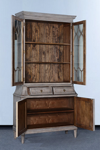 Load image into Gallery viewer, Elevate your dining or living space with the timeless elegance of the Rosalind China Cabinet. Handcrafted from solid mango wood and mango wood veneers, this cabinet combines durability with natural beauty, showcasing the wood's rich, warm tones and unique grain patterns. Its sleek design is complemented by solid brass hardware, adding a touch of refined sophistication. Good Bones Furniture