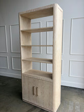 Load image into Gallery viewer, The Horizon Etagere by Theodore Alexander combines generous display space with a light, contemporary silhouette. Crafted from oak in a pale Day finish, its softly rounded frame and finely reeded details introduce texture while preserving the collection’s clean lines. Multiple open shelves provide ample room for books, art, and collected objects, while the two-door cabinet below offers convenient concealed storage. Good Bones Furniture