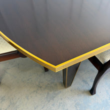 Load image into Gallery viewer, Theodore Alexander Sebastiano Dining Table pairs a historic silhouette with a modern, tailored edge. Its gently curved rectangular top is framed by a brass-bound apron that gives the piece a crisp, architectural presence, while slatted baluster legs outlined in gilt add depth and refinement. Open box showroom sample. Good Bones Furniture