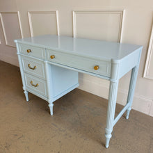 Load image into Gallery viewer, Angled view of a Thomasville vintage writing desk finished in Sherwin-Williams Billowy Breeze, highlighting the tailored silhouette, airy blue lacquer, and updated brushed brass hardware by Good Bones Furniture