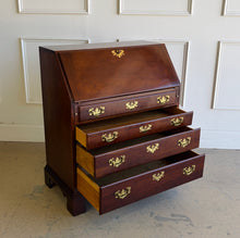 Load image into Gallery viewer, This traditional Chippendale mahogany secretary combines classic American craftsmanship with everyday functionality in a compact footprint. Crafted in rich mahogany with a warm satin finish, it features a slant-front writing surface that opens to reveal a thoughtfully organized interior complete with pigeonholes, two small drawers, and a center cabinet for storing stationery and essentials. Good Bones Furniture