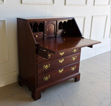 Load image into Gallery viewer, This traditional Chippendale mahogany secretary combines classic American craftsmanship with everyday functionality in a compact footprint. Crafted in rich mahogany with a warm satin finish, it features a slant-front writing surface that opens to reveal a thoughtfully organized interior complete with pigeonholes, two small drawers, and a center cabinet for storing stationery and essentials. Good Bones Furniture