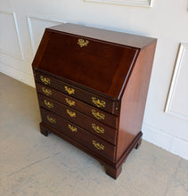 Load image into Gallery viewer, This traditional Chippendale mahogany secretary combines classic American craftsmanship with everyday functionality in a compact footprint. Crafted in rich mahogany with a warm satin finish, it features a slant-front writing surface that opens to reveal a thoughtfully organized interior complete with pigeonholes, two small drawers, and a center cabinet for storing stationery and essentials. Good Bones Furniture