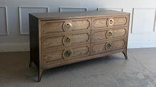 Load image into Gallery viewer, This handsome six-drawer dresser by Vanguard Furniture blends tailored lines with refined transitional styling. Crafted with beautifully grained oak veneers, it features sculpted drawer fronts, oversized antiqued brass ring pulls, and elegantly tapered legs that give the piece a sophisticated presence. Good Bones Furniture