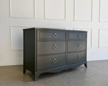 Load image into Gallery viewer, Vintage six drawer dresser refinished in Sherwin Williams Urbane Bronze with satin lacquer finish and brass ring pulls, photographed in the Good Bones Furniture studio in Raleigh, North Carolina.