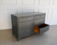 Load image into Gallery viewer, Vintage six drawer dresser with one drawer open, revealing solid wood drawer construction beneath a Sherwin Williams Urbane Bronze lacquer finish by Good Bones Furniture.