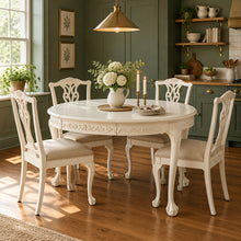 Load image into Gallery viewer, This vintage Chippendale-style dining table combines elaborate traditional detailing with a fresh, versatile finish. Professionally lacquered in Benjamin Moore Swiss Coffee darkened by 50%, it has a warm, creamy white appearance that highlights its carved details without feeling stark. Good Bones Furniture