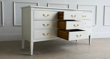 Load image into Gallery viewer, Vintage 9 drawer dresser by Dixie Furniture offers substantial storage within a timeless, beautifully proportioned silhouette. Professionally lacquered in Benjamin Moore Swiss Coffee at 150% strength, its warm creamy-white finish highlights the clean lines, inset drawer fronts, and tapered legs. Good Bones Furniture