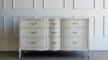 Load image into Gallery viewer, Elegant curves, classic proportions, and the kind of quality Drexel is known for make this vintage French dresser an easy choice for a custom lacquer finish. With nine drawers and a beautifully shaped front, it offers generous storage while keeping a light, refined silhouette. The cabriole-style legs and subtle molded details give it that timeless French character. Good Bones Furniture